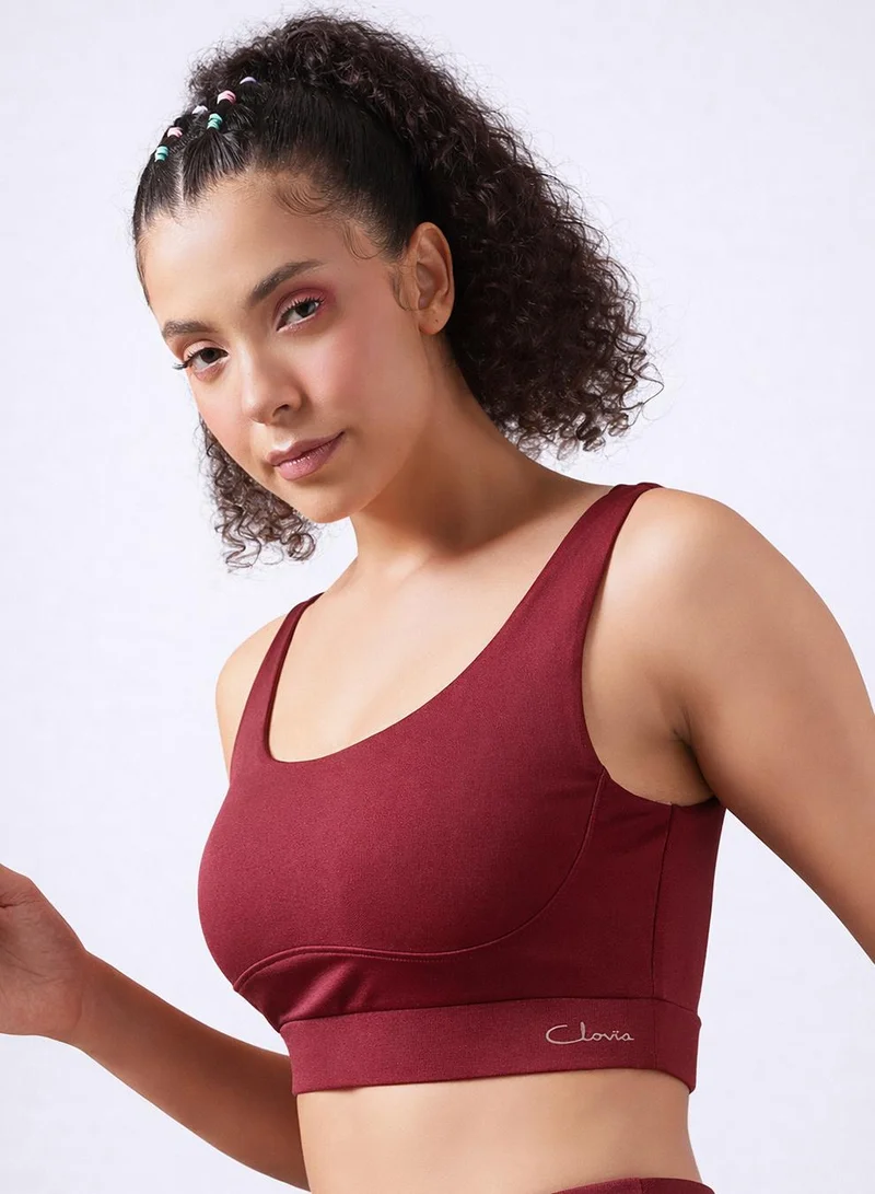 Clovia Red Medium Impact Sports Bra in Maroon with Removable Cups for Women | Best Price UAE